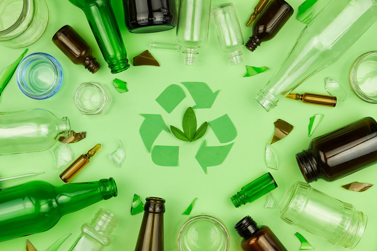 Green recycle sign symbol with glass