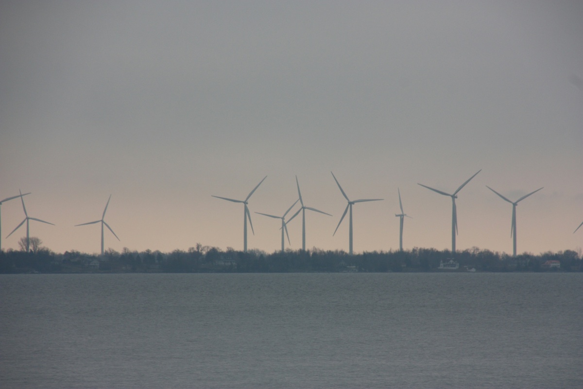 row of wind turbines in the distance